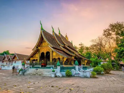 Cultural immersion en route to Nakhon Si Thammarat, traveling through lush tropical landscapes to the ancient Wat Phra Mahathat temple