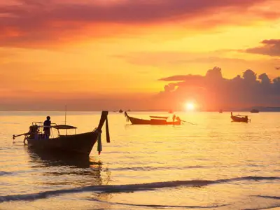 Scenic ride through palm plantations and stunning karst cliffs towards the magical bay of Phang Nga