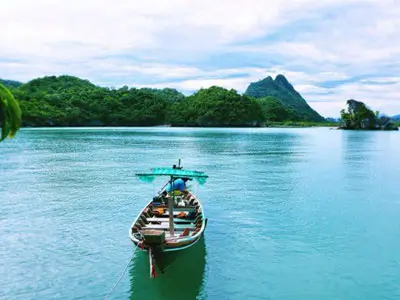 Picturesque route through green valleys to Khanom, a hidden village with deserted beaches and rare pink dolphins